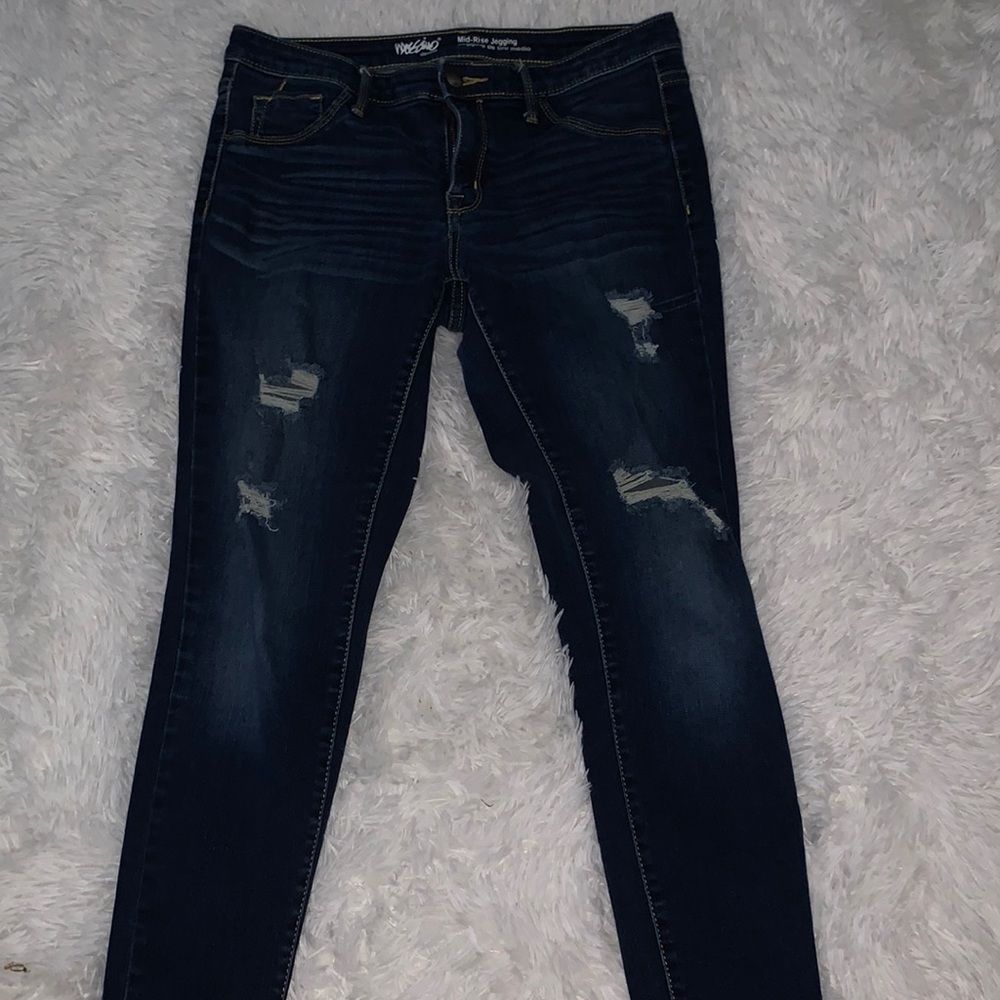 Dark blue stretchy mid rise jeggings